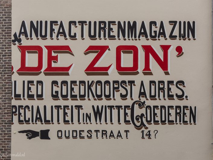 Muurreclame De Zon